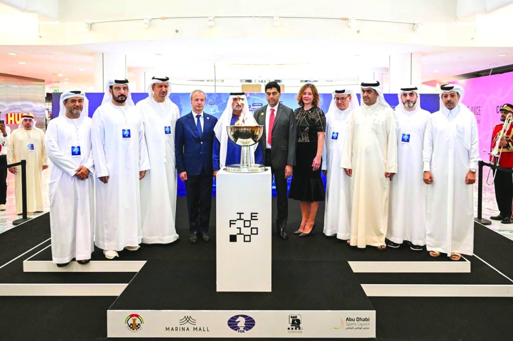 President of the Qatar Chess Association Mohamed al-Mudahka with officials.