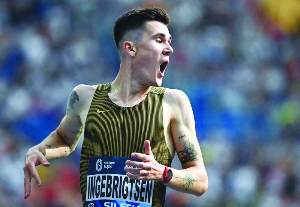 Jakob Ingebrigtsen reacts after setting a new world record in the men’s 3,000m on Sunday. (AFP)