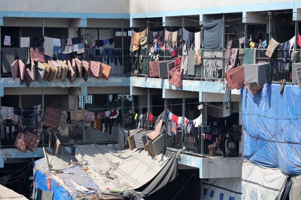 Displaced Palestinians shelter in a United Nations-run school, in Deir Al-Balah in the central Gaza Strip, Tuesday.