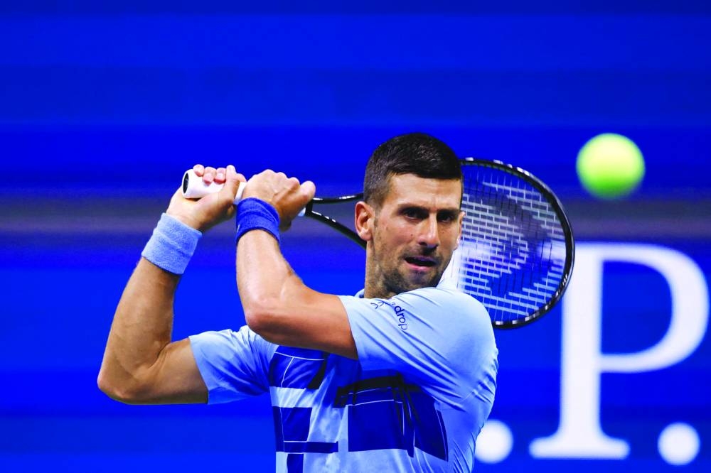 
Serbia’s Novak Djokovic returns the ball to Moldova’s Radu Albot during their first-round match at the US Open at the USTA Billie Jean King National Tennis Center in New York. (AFP) 