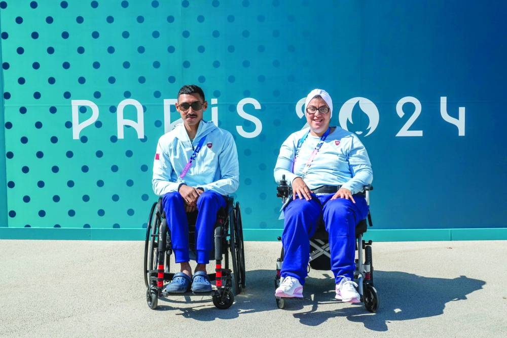 Qatar’s Ali Arshad and Sarah Masoud pose at the Paris Paralympic Games Village on Tuesday, ahead of the opening ceremony.
