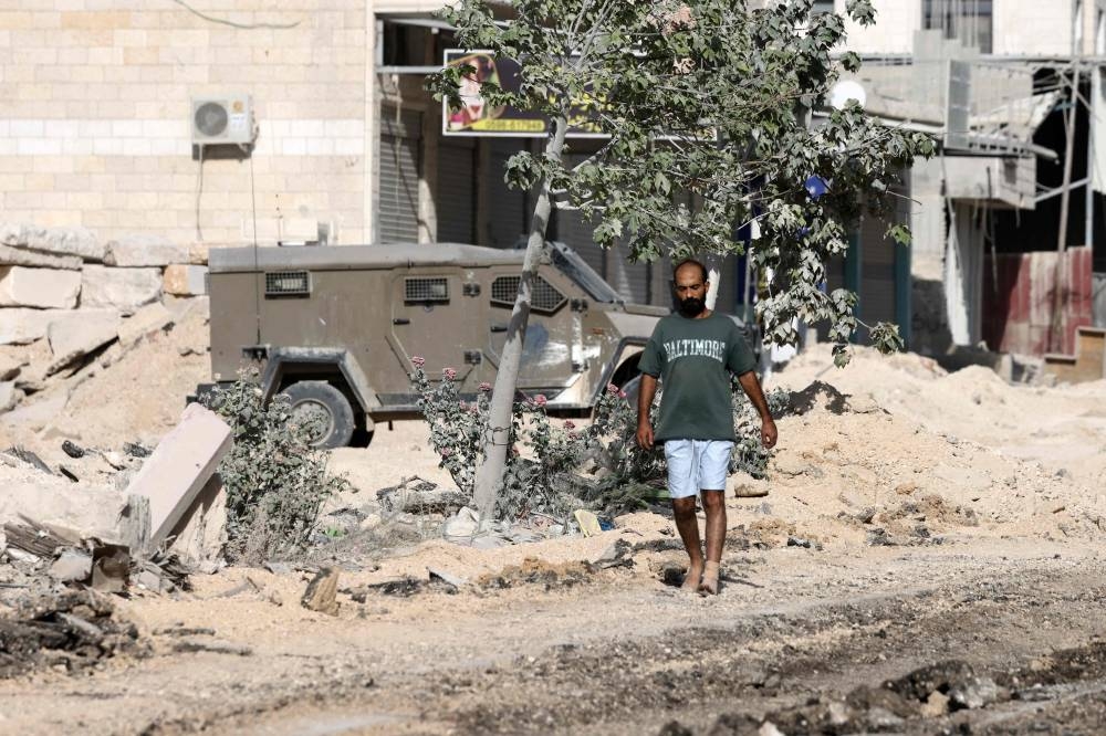 A Palestinian man is released by Israeli troops after being arrested and interrogated during a raid in the Nur Shams camp for near the city of Tulkarem in the Israeli-occupied West Bank on Wednesday. AFP