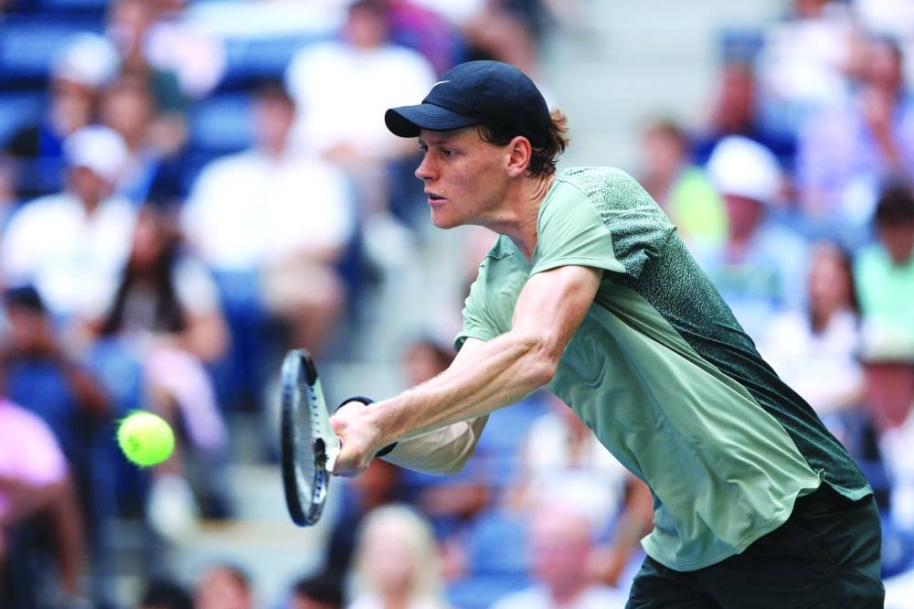 
Jannik Sinner of Italy returns against Mackenzie McDonald of the US during their match at the 2024 US Open in New York. (AFP) 