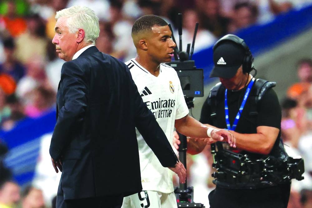 
Real Madrid’s forward Kylian Mbappe (right) and coach Carlo Ancelotti. (AFP) 