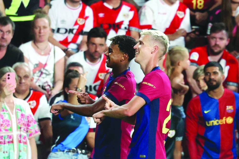 
Barcelona’s Dani Olmo (right) celebrates with Lamine Yamal after scoring against Rayo Vallecano during the La Liga match on Tuesday. (AFP) 
