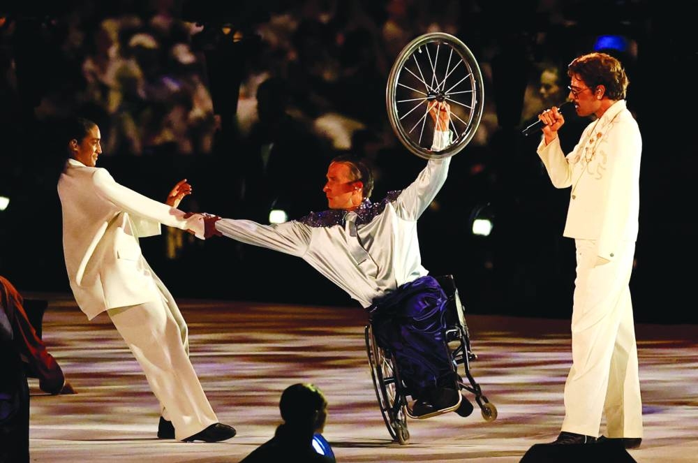 
French singer Lucky Love, who is missing his left arm below the elbow, performed a rendition of his song My Ability surrounded by both able-bodied and disabled dancers. 