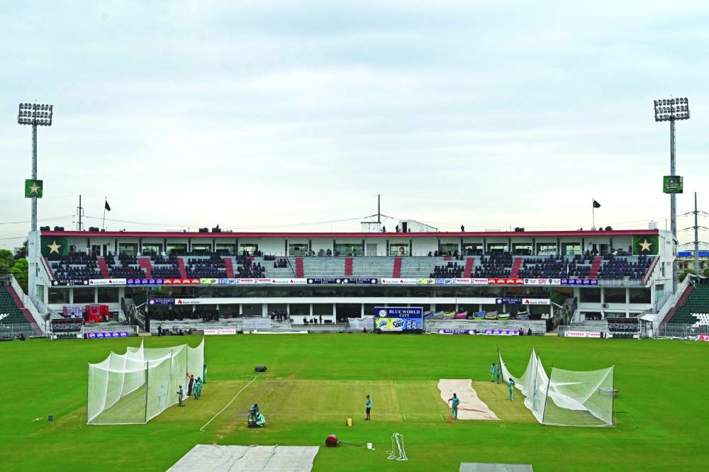 Groundmen prepare nets for training sessions of the Pakistan and Bangladesh teams at the Rawalpindi Cricket Stadium in Rawalpindi on Thursday. (AFP)