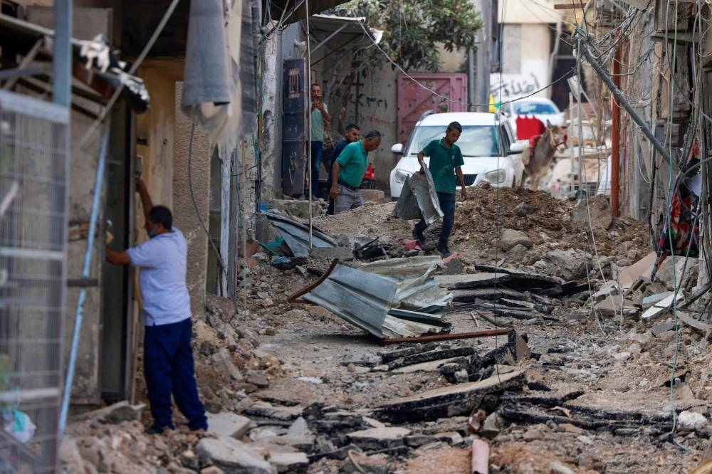 People check the devastation in the the Nur Shams refugee camp near Tulkarem in the occupied-West Bank in the aftermath of a large-scale Israeli military operation on Friday. AFP
