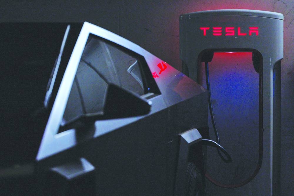 
A Tesla Cybertruck charges at a Supercharger in Palm Springs, California. 