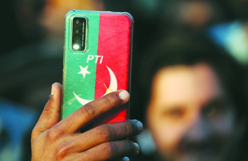 
In February, young Pakistanis delivered a shock result when, defying the military, they voted en masse for the imprisoned former prime minister Imran Khan. (Reuters) 