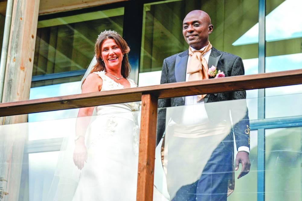 
Princess Martha Louise of Norway and Durek Verrett arrive at their wedding party at Hotel Unio in Geiranger yesterday. Right: Norway’s King Harald, Queen Sonja, Crown Prince Haakon, Crown Princess Mette-Marit, Princess Ingrid Alexandra, and Prince Sverre Magnus pose for pictures aboard the royal yacht in the Geirangerfjord on the day of the wedding. (AFP, Reuters) 
