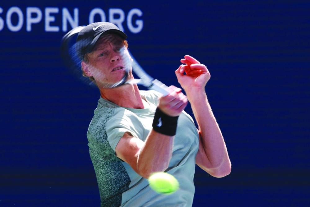 Italy’s Jannik Sinner plays a return to Australia’s Christopher O’Connell during their third-round match on Saturday. (AFP)