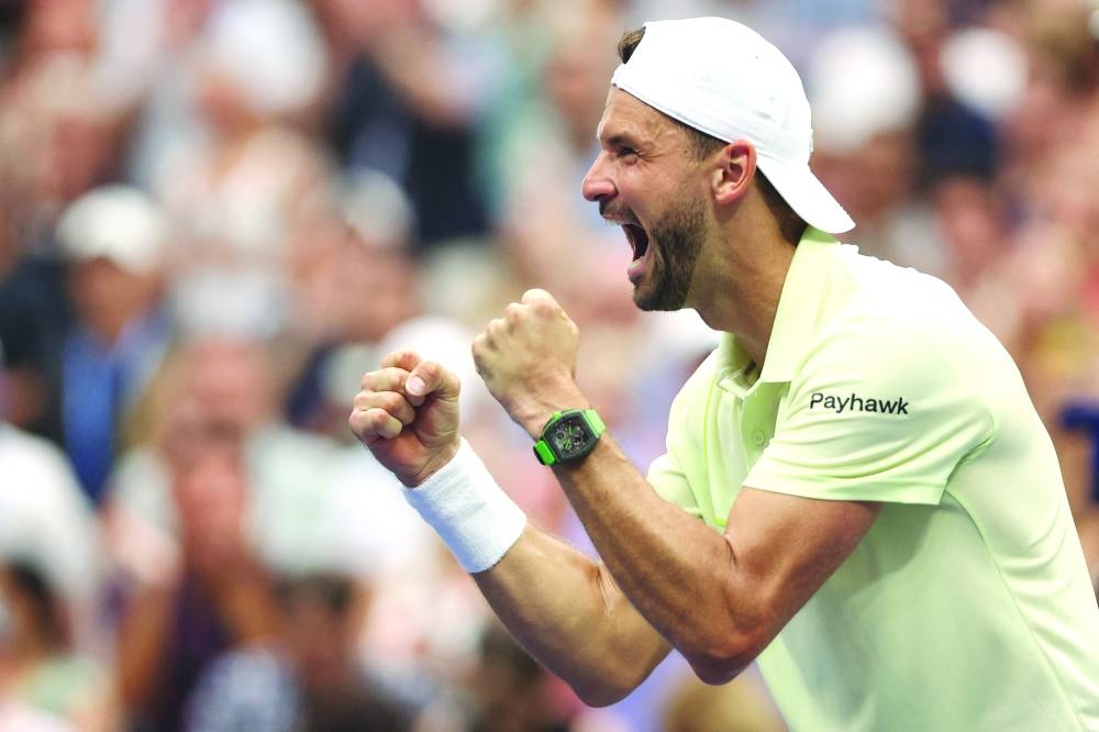 Grigor Dimitrov of Bulgaria celebrates his victory over Andrey Rublev of Russia in the US Open fourth round match on Sunday. (AFP)