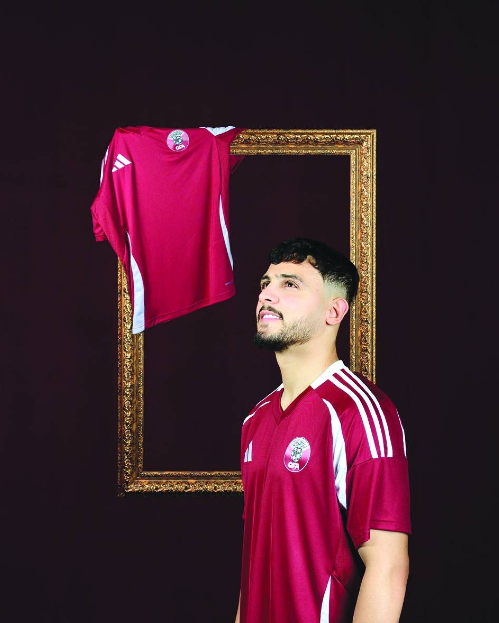 Bassem al-Rawi pose sporting team’s new kit unveiled by the Qatar Football Association on Sunday, ahead of the FIFA World Cup 2026 qualifier against UAE.