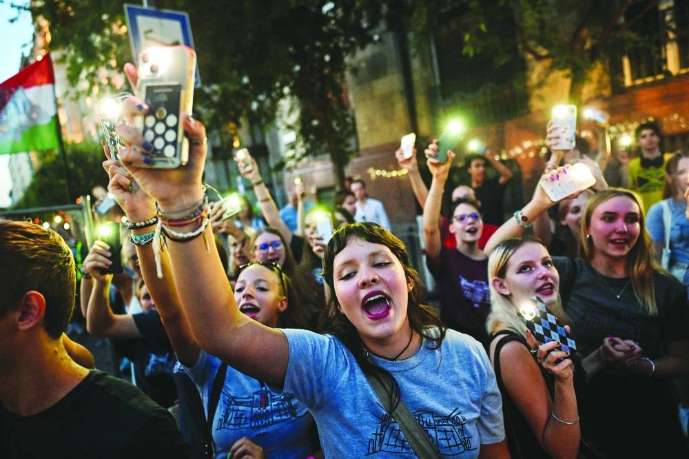 SMARTING: People take part in a demonstration in Budapest on Monday after the principal of a leading public high school was dismissed for disagreeing with a new government policy about banning students from using mobile phones in schools. (Reuters)