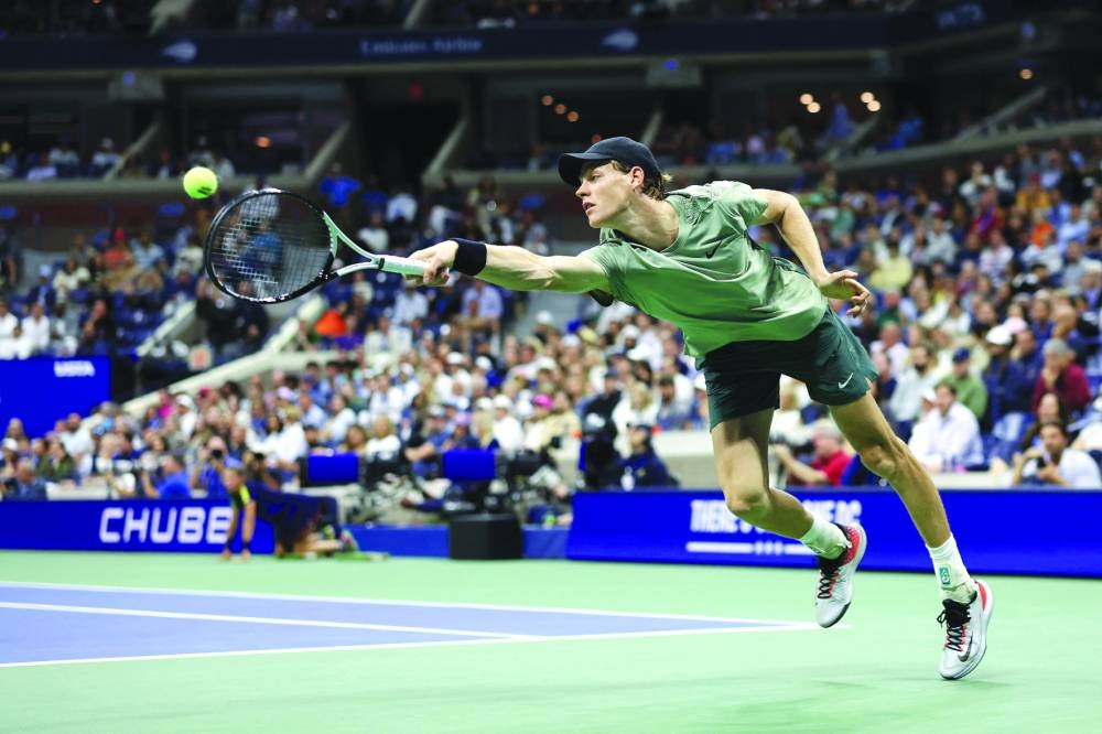 
Jannik Sinner returns a shot against Tommy Paul during their fourth round match. (AFP) 