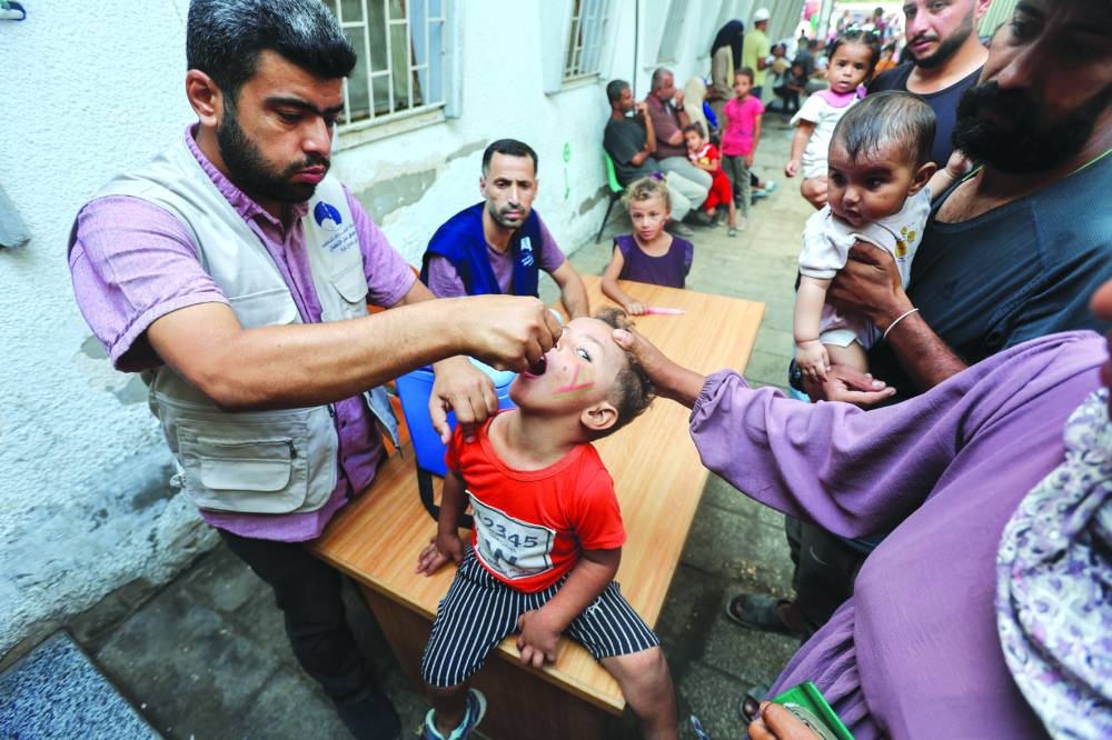 A Palestinian child is vaccinated against polio, amid the Israel-Hamas conflict, in Deir Al-Balah in the central Gaza Strip, yesterday.