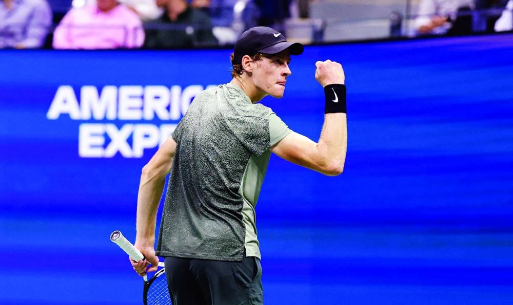Italy’s Jannik Sinner celebrates defeating Russia’s Daniil Medvedev in the US Open quarter-final at the USTA Billie Jean King National Tennis Center in New York on Thursday. (AFP)