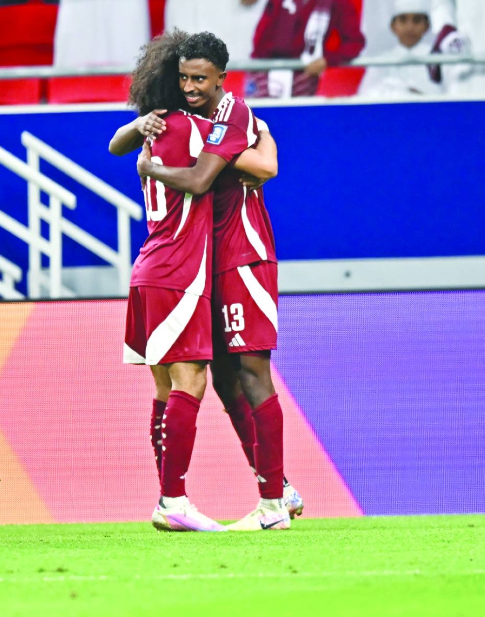 
Qatar’s teenager Ibrahim al-Hassan (right) celebrates with Akram Afif after scoring. 