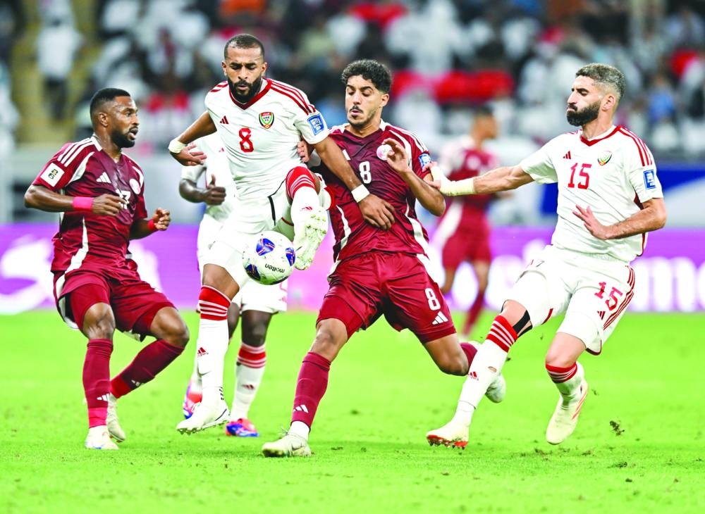 Qatar and UAE players vie for the ball during the FIFA World Cup 2026 qualifier at the Ahmad Bin Ali Stadium in Al Rayyan on Thursday. PICTURES: Noushad Thekkayil