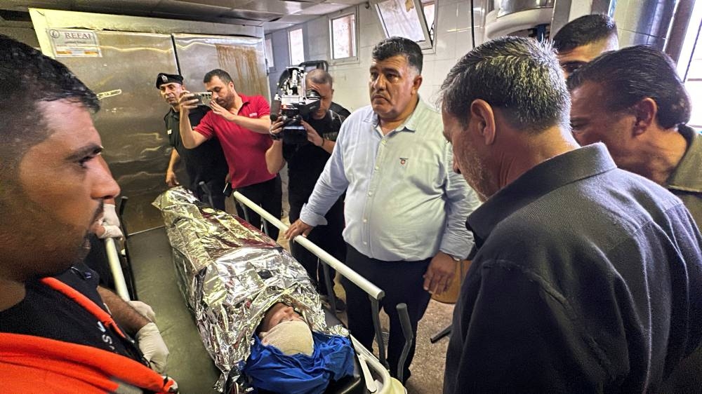 People react as they gather at a hospital around a US citizen, who was taking part in a protest against settlement expansion, died of her wounds after being shot in the head by Israeli troops, in Nablus, Israeli-occupied West Bank, Friday. REUTERS