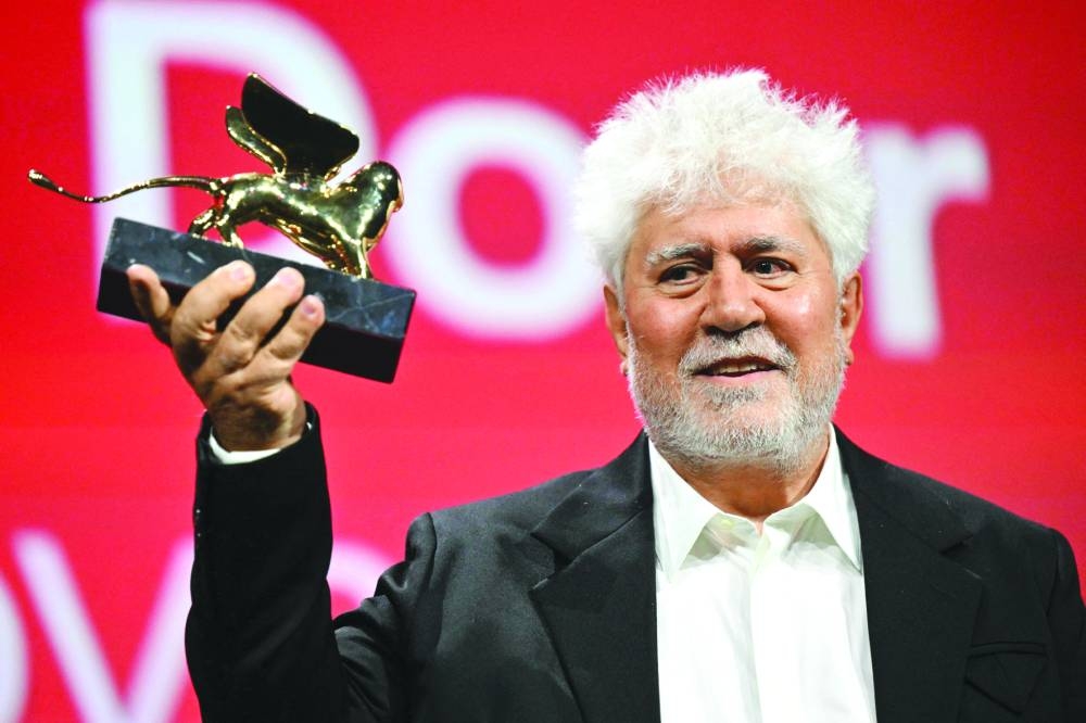 
(L-R) Spanish director Pedro Almodovar poses with the Golden Lion for Best Film; Vincent Lindon poses with the Coppa Volpi for Best Actor; and US-Australian actress Nicole Kidman, who won the Best Actress award, but was not on hand to receive it after her mother died. (AFP) 