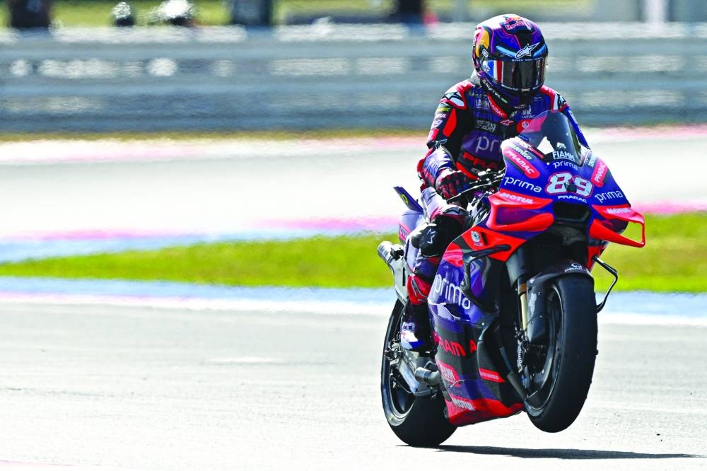 Ducati Spanish rider Jorge Martin (also inset) celebrates with a ‘wheelie’ after winning the sprint race of the San Marino MotoGP Grand Prix at Misano World Circuit Marco-Simoncelli in Misano Adriatico on Saturday. (AFP)