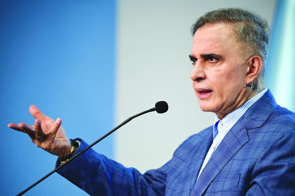 Attorney-General Saab addressing the media in Caracas. – Reuters