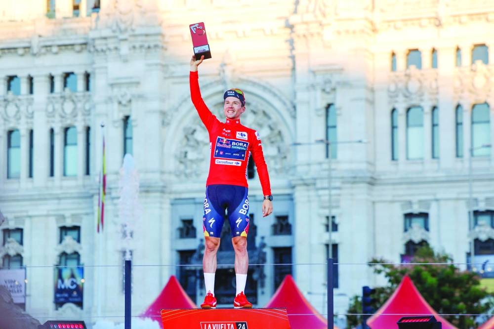 Overall leader Team Bora’s Primoz Roglic celebrates on the podium after the last stage of the Vuelta a Espana, a 24.6km time-trial race between Madrid and Madrid, on Sunday. (AFP)