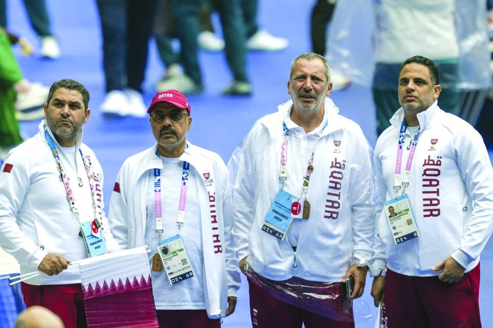Qatar’s head of the delegation Dr Hassan al-Ansari (2nd L) hailed the two athletes for their hard work while praising the dazzling ceremony to mark an end to spectacular Games.