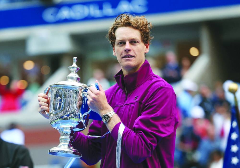 Italy's Jannik Sinner poses with the trophy after winning his final match against Taylor Fritz of the US. (Reuters)