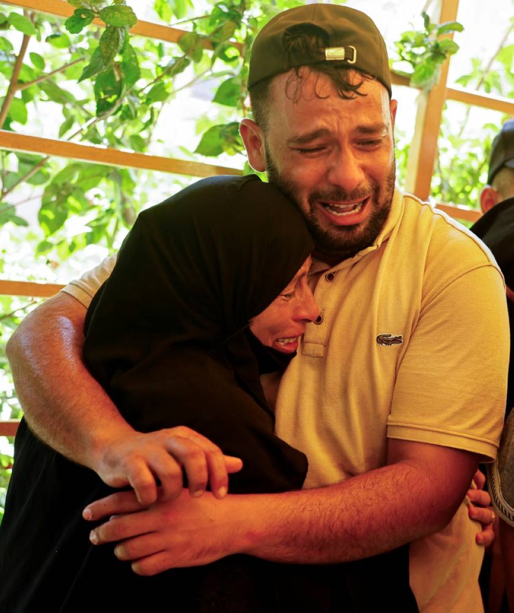 Relatives mourn Palestinians from Al-Bayouk family, who were killed in an Israeli strike, at Nasser hospital in Khan Younis, in the southern Gaza Strip, on Tuesday. REUTERS