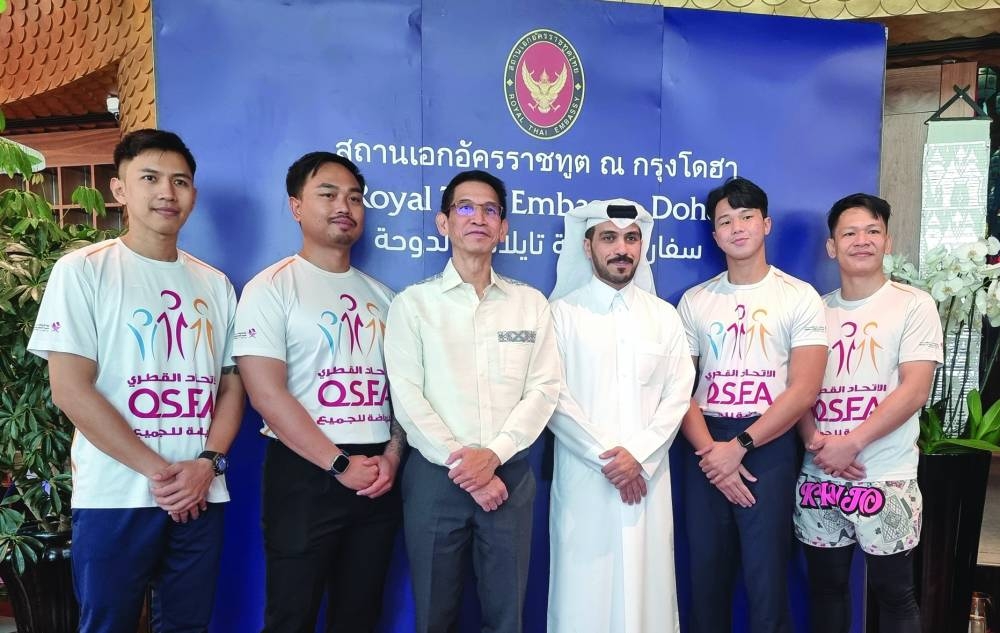 Sira Swangsilpa and Abdullah al-Dosari with Muay Thai coaches and trainers.  PICTURE: Joey Aguilar