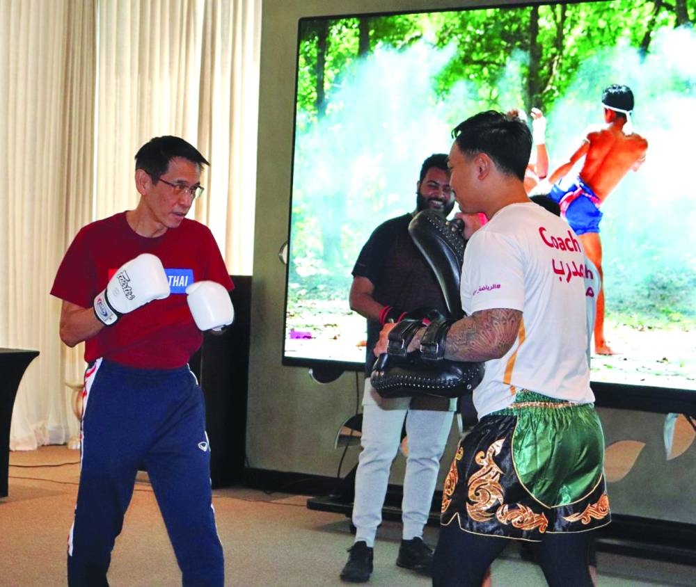 Ambassador Sira Swangsilpa takes part in the live Muay Thai demo. (Supplied picture)