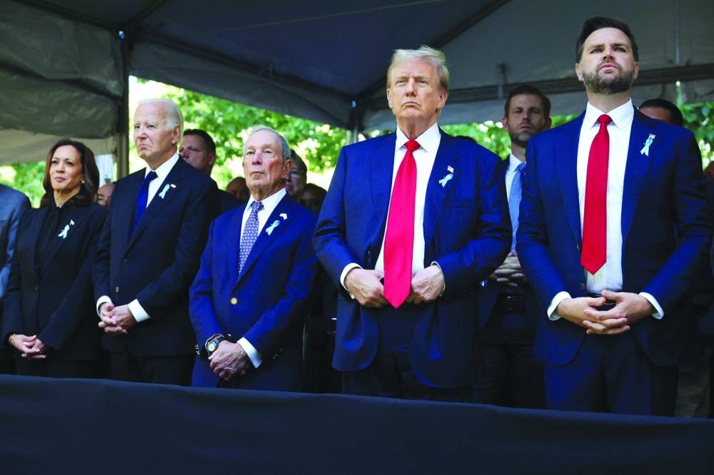 (From left) Democratic presidential nominee, US Vice-President Kamala Harris, US President Joe Biden, former Mayor of New York Michael Bloomberg, Republican presidential nominee, former US President Donald Trump and Republican vice-presidential candidate Sen J.D. Vance (R-OH) join family and friends at Ground Zero honouring the lives of those lost on the 23rd anniversary of the terror attacks of September 11, 2001, at the World Trade Center in New York City, yesterday.