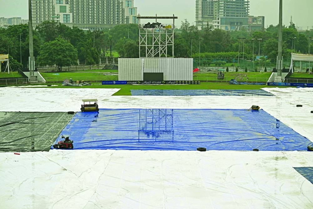 The covered ground is pictured after the one-off Test between Afghanistan and New Zealand was called off due to rains at the Shahid Vijay Singh Pathik Sports Complex in Greater Noida on Wednesday. (AFP)