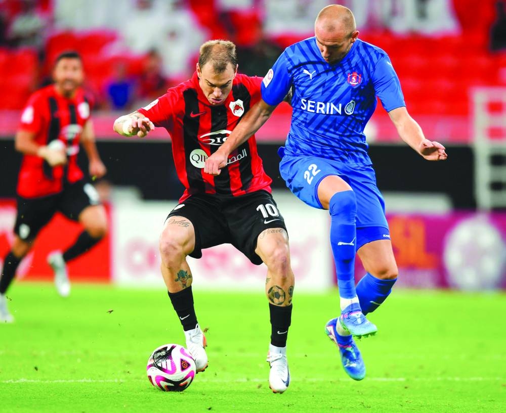 Al Rayyan’s Roger Guedes (left) vies for the ball with Al Shahania’s Sven van Beek at the at the Ahmad Bin Ali Stadium on Friday.