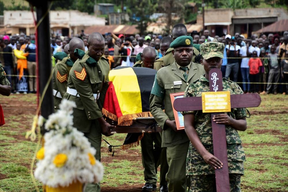 Soldiers from Uganda People's Defence Forces (UPDF) carry the flag-draped coffin of the slain Ugandan Olympian Rebecca Cheptegei, during her funeral at the Bukwo District, Uganda on Saturday. REUTERS