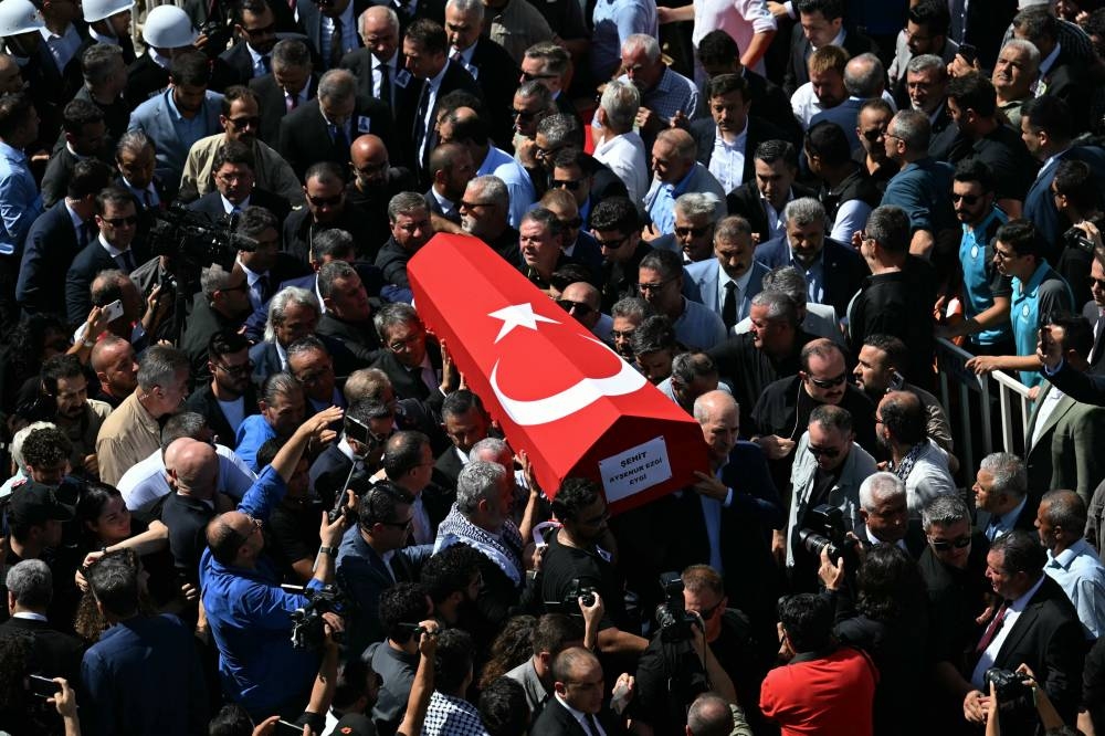 Family members, attendees and officials carry the coffin of late Turkish-American activist Aysenur Ezgi Eygi, shot dead by Israeli forces while protesting against illegal Israeli settlements in the occupied West Bank, at the Didim central mosque.