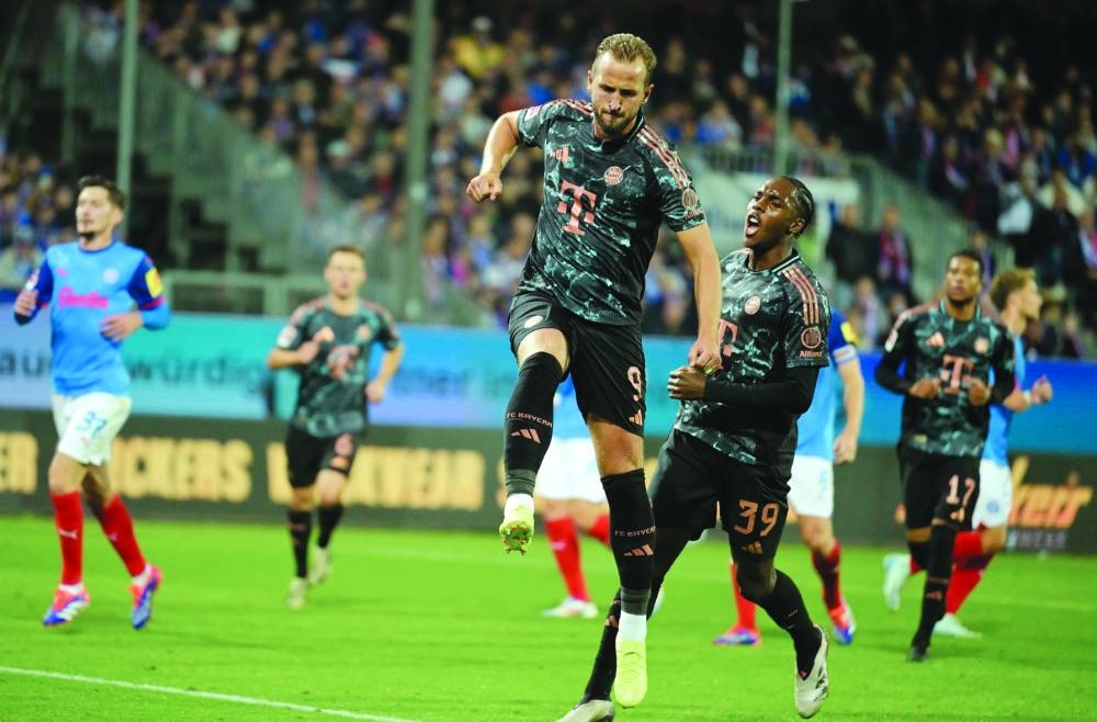 Bayern Munich’s Harry Kane celebrates scoring their sixth goal and completing his hat-trick against Holstein Kiel at Holstein-Stadion, Kiel, Germany, on Saturday. (Reuters)