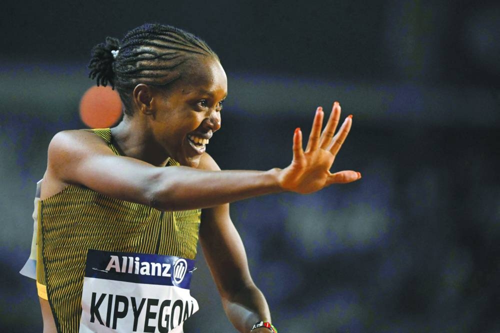 
Kenya’s Faith Kipyegon celebrates after winning the Women’s 1500m final. 
