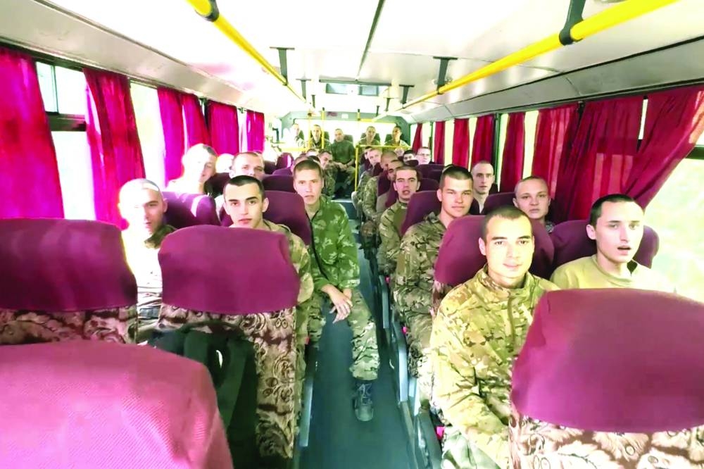 A video grab shows Russian prisoners sitting in a bus following the swap. (AFP)