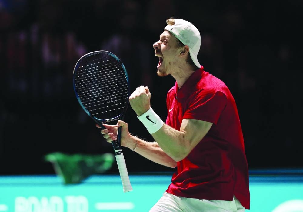 Canada’s Denis Shapovalov celebrates winning his Davis Cup Group D match against Britain’s Daniel Evans at AO Arena in Manchester, Britain, on Sunday. (Reuters)