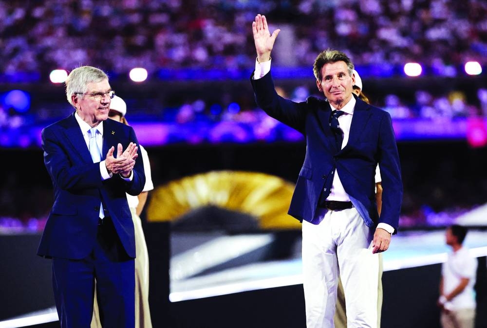 
International Olympic Committee (IOC) President Thomas Bach (left) and World Athletics President Sebastian Coe during the medal ceremony after the women’s marathon final at Stade de France, Saint-Denis, France, on August 11, 2024. (Reuters) 