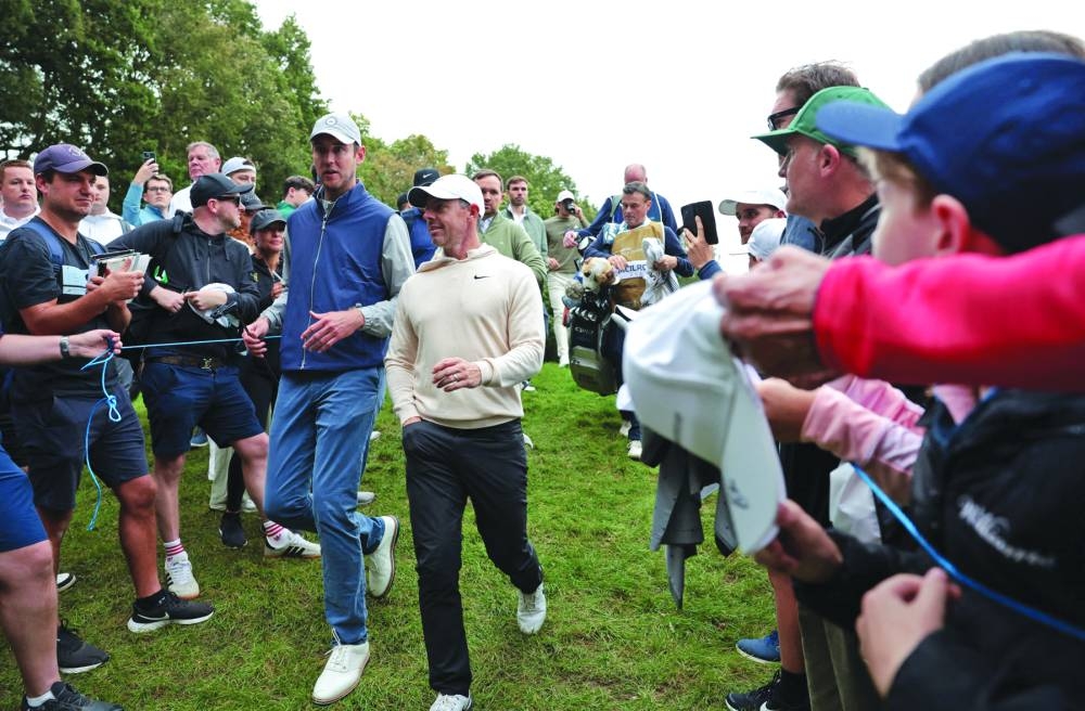 Northern Ireland’s Rory McIlroy with former England cricketer Stuart Broad during the Pro-Am at the BMW PGA Championship at Wentworth Club, Virginia Water, Britain, on Wednesday. (Reuters)