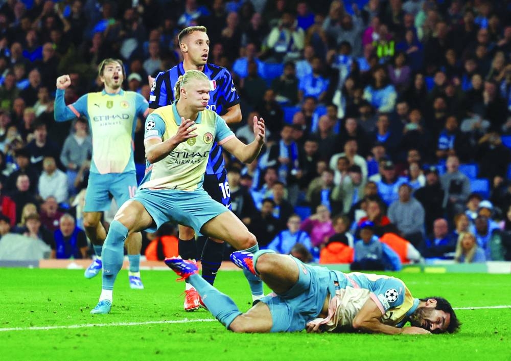 
 Manchester City’s Ilkay Gundogan and Erling Haaland react after a missed chance. 