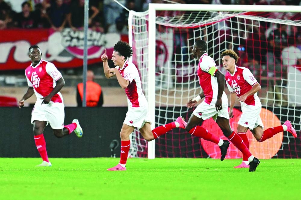 
Monaco’s French midfielder Maghnes Akliouche (second left) celebrates with teammates after scoring against Barcelona during the UEFA Champions League match. (AFP) 
