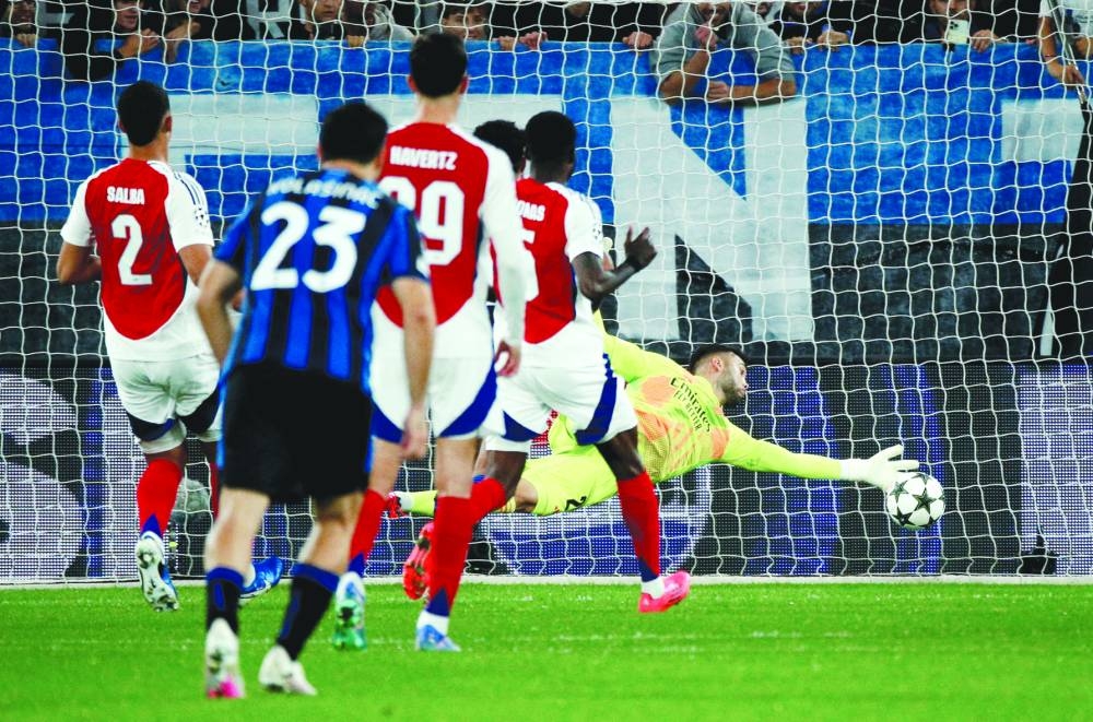 
Arsenal’s David Raya saves the rebound shot from Atalanta’s Mateo Retegui after saving a penalty during the Champions League match at the Gewiss Stadium in Bergamo, Italy. (Reuters) 