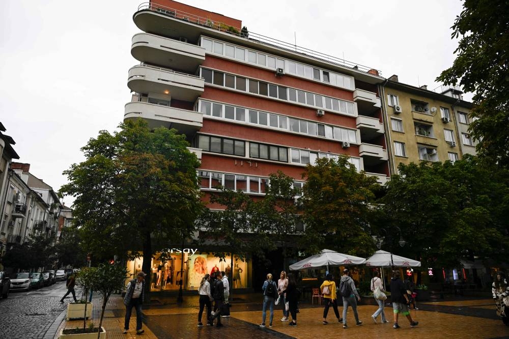 Pedestrians walk past the building which reportedly houses the Norta Global company according to company contacts, in Sofia, on Thursday.  AFP