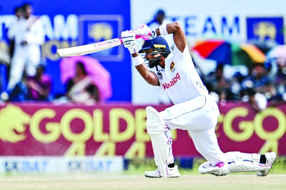 Sri Lanka’s Dinesh Chandimal plays a shot during the third day of the first Test against New Zealand at the Galle International Cricket Stadium in Galle on Friday. (AFP)